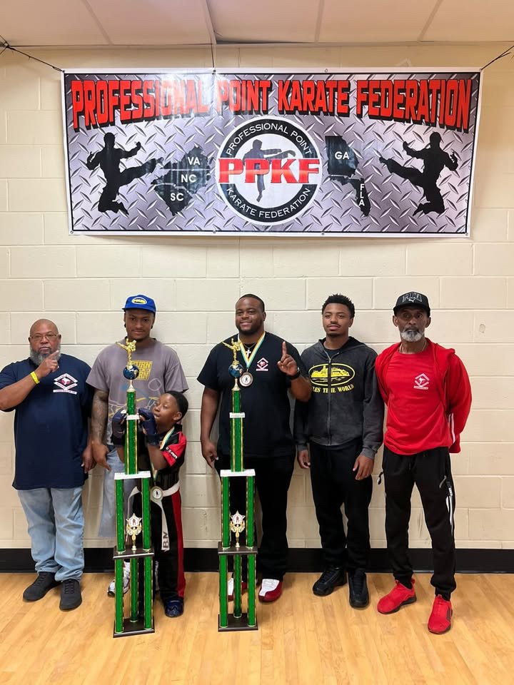 Karate team celebrating at a Professional Point Karate Federation event