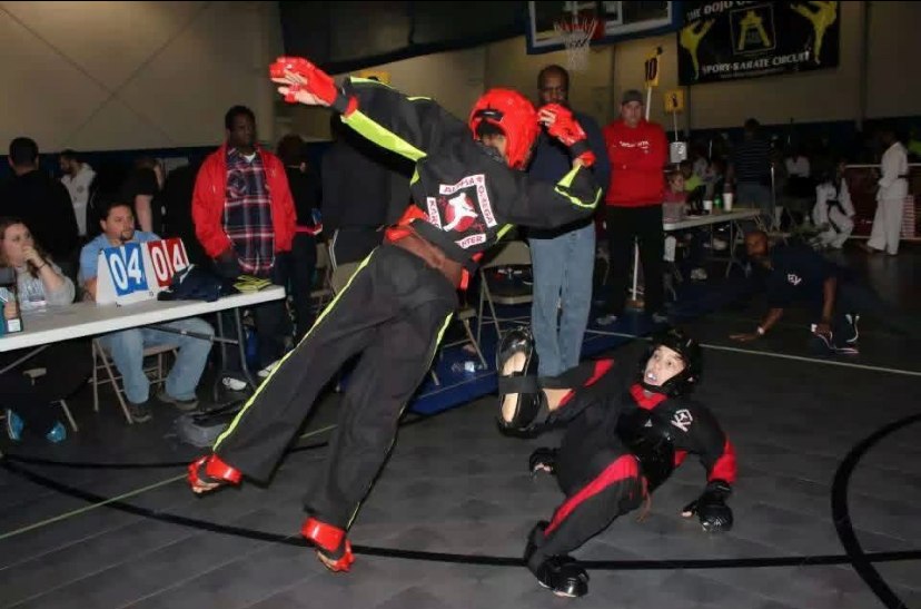 Alpha & Omega karate athlete competing in a sparring match